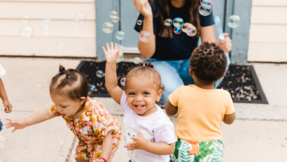 Children playing and blowing bubbles.